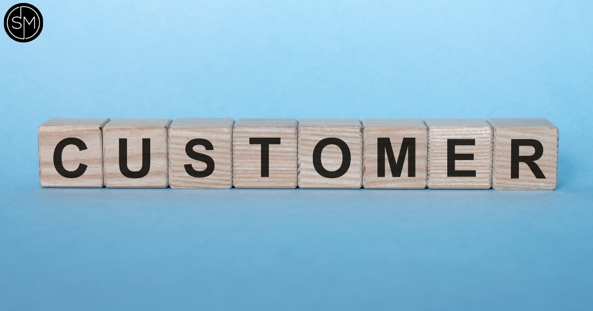 Customer word spelled out with wooden blocks