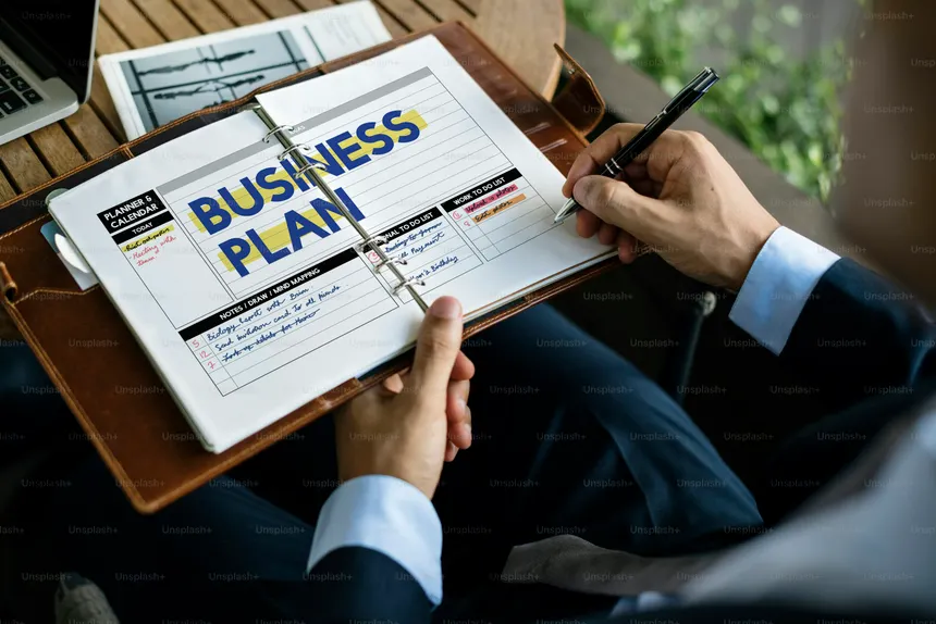Business plan written inside a planner