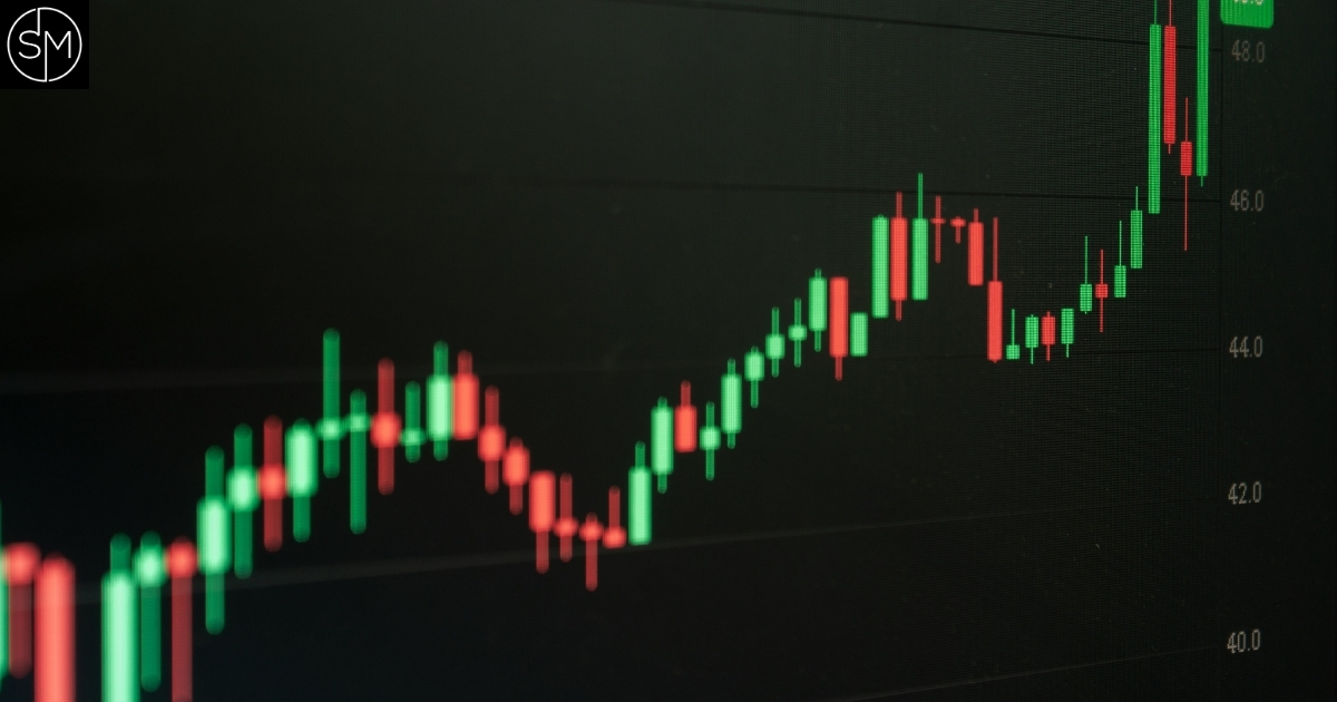 Trending candlestick chart on a dark screen